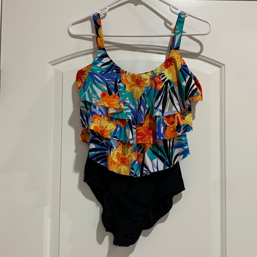 Like new one piece swimsuit w/ruffled top, size 8-10, beautiful bright floral.